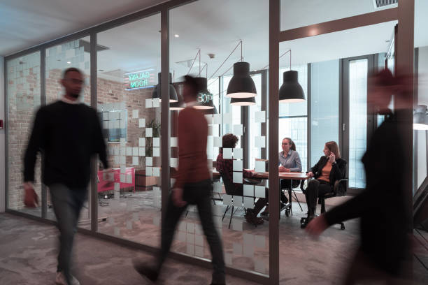 istock Successful team. Group of young multi-ethnic business people working and communicating together in creative office. Selective focus 1398991327