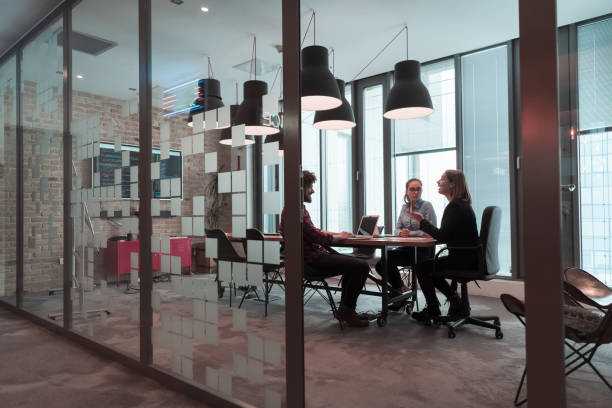 istock Successful team. Group of young multi-ethnic business people working and communicating together in creative office. Selective focus 1398991567