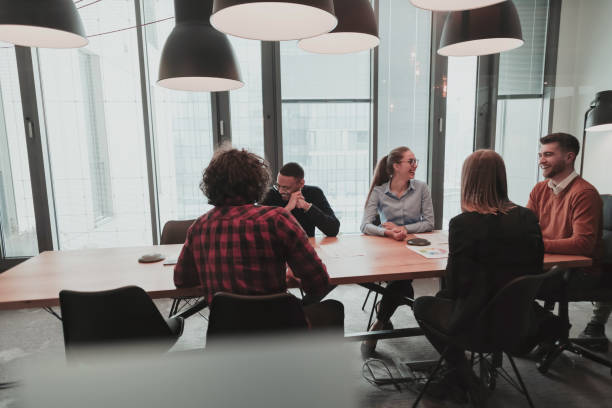 istock Successful team. Group of young multi-ethnic business people working and communicating together in creative office. Selective focus 1398992626