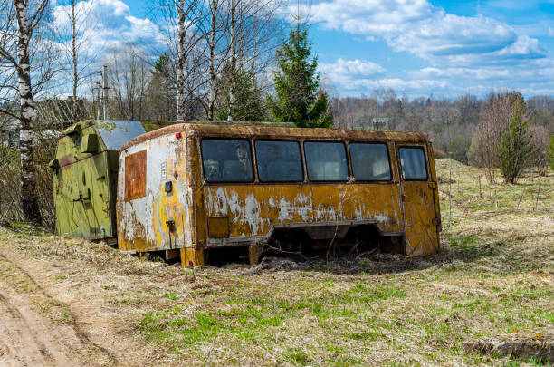 istock An old rusty bus abandoned in the woods. 1398993862