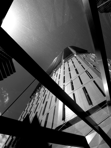 Skyscraper in Brisbane, Australia taken from underneath a glass canopy.
