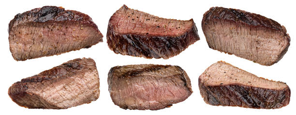 istock Grilled beef slices isolated on white background 1398994406