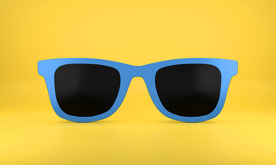 Blue Sunglasses On Yellow Background with shadow.
