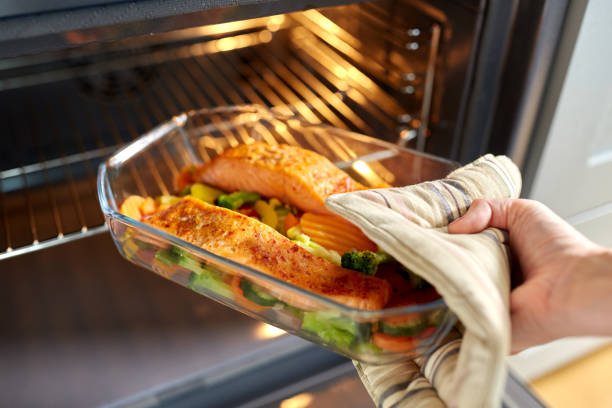 istock woman cooking food in oven at home kitchen 1398998043
