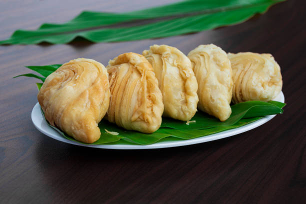 Malaysia popular and traditional snack Karipap filled with potato fillings. stock photo