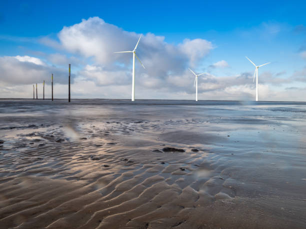 wind farm on the north sea coast - duitse noordzeekust stockfoto's en -beelden