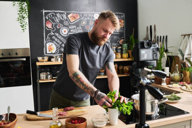 istock Man Cooing Delicious Meal On Camera 1398999391