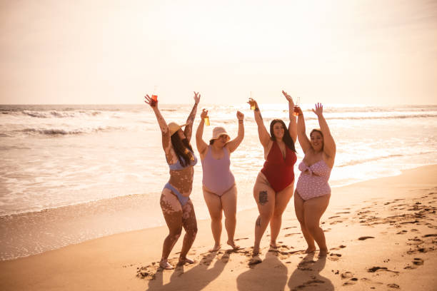 istock Friends drinking and celebrating on the beach 1399001067