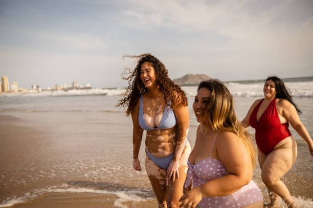 istock Friends having fun on the beach 1399001111