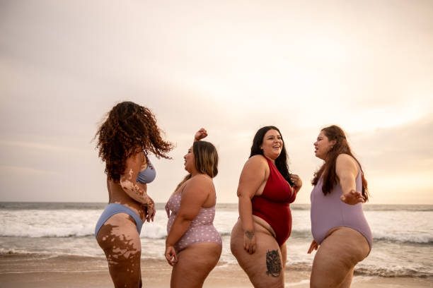 istock Friends having fun dancing in the beach 1399001293