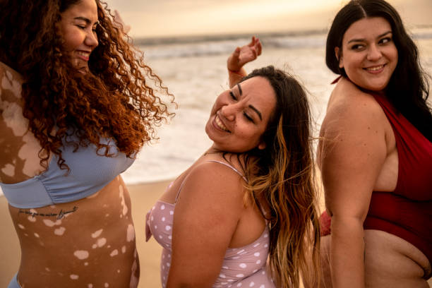 istock Friends having fun dancing in the beach 1399001397