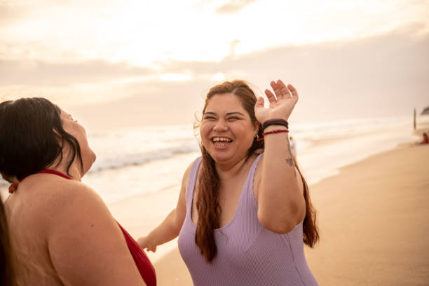 istock Friends having fun dancing in the beach 1399001411