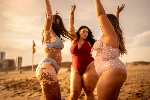 istock Young women having fun on the beach 1399001462