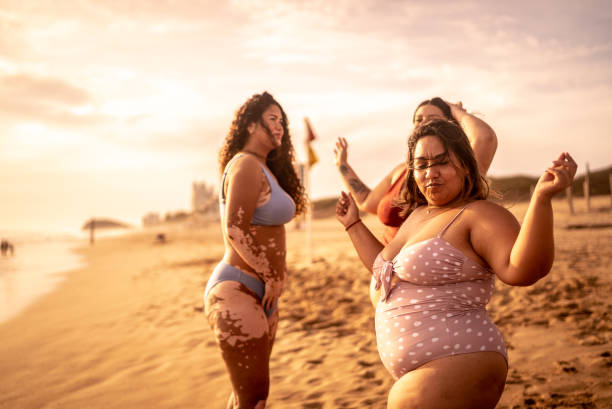 istock Young women having fun on the beach 1399001472