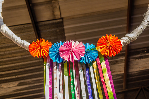 Goiania, Goiás, Brazil – May 22, 2022: A creative party decoration, made with cut paper and colored ribbons.