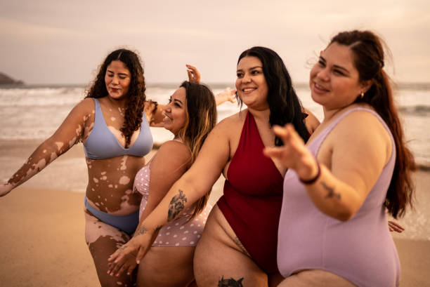 istock Young women having fun on the beach 1399003149