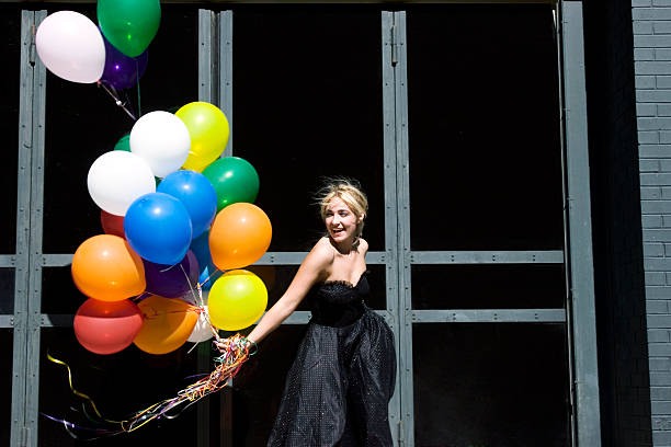 istock Young blond woman with balloons 139900363