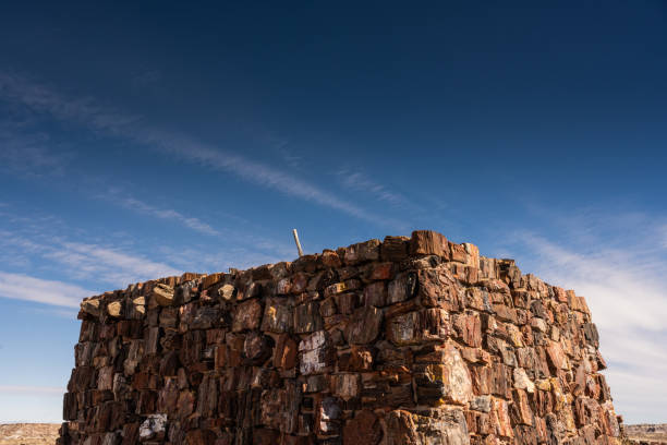 Agate House Against A Blue Sky and Whispy Clouds Agate House Against A Blue Sky and Whispy Clouds in Petrified Forest National Park archaelogy stock pictures, royalty-free photos & images