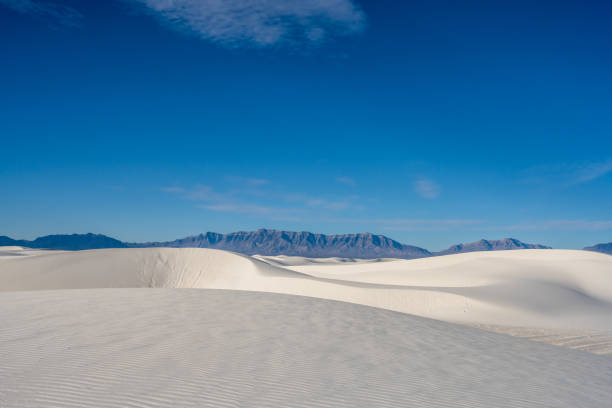 istock Rolling Sand Dunes And San Andres Mountains Sit Under A Partially Cloudy Sky 1399006585