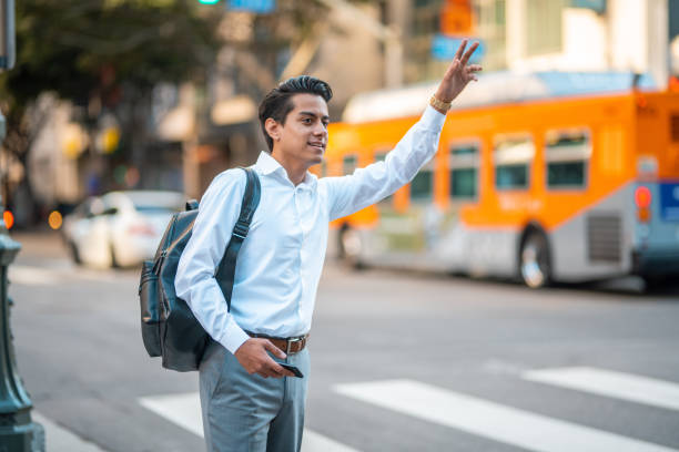 istock Young Adult Hispanic Businessman on Calling a Cab 1399006681