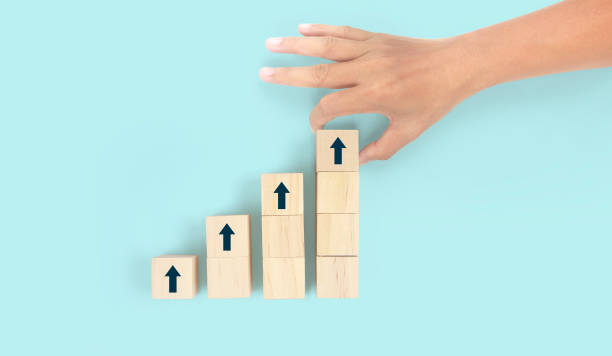 istock Business connecting piece of multi wood chart blocks steps in hand 1399007294