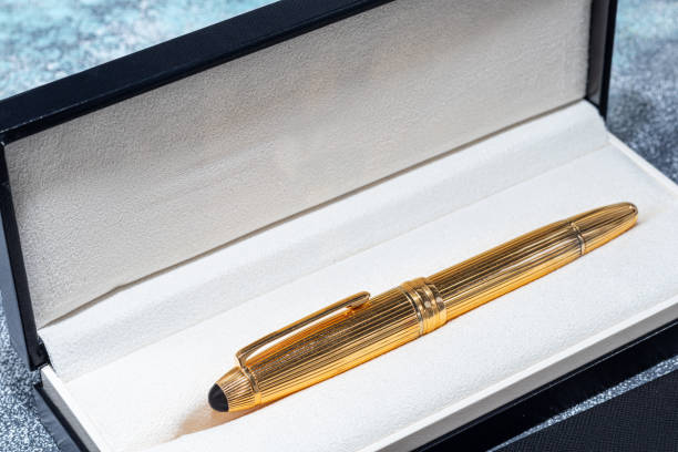 istock Fountain pen on a marble and gray background. Selective focus. 1399007411