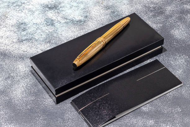 istock Fountain pen on a marble and gray background. Selective focus. 1399007414
