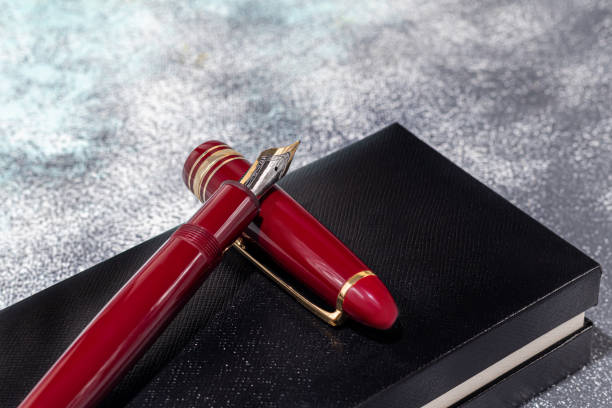 istock Fountain pen on a marble and gray background. Selective focus. 1399007451