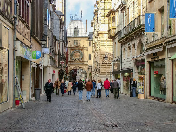 Ancien street in Rouen in France Rouen, Normandy,"nFrance - October 20, 2005: Old streets and ancient clocks. Many people. rue du gros horloge photos stock pictures, royalty-free photos & images