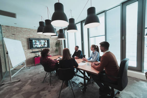 istock Successful team. Group of young multi-ethnic business people working and communicating together in creative office. Selective focus 1399009909