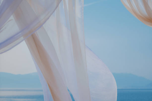 istock White pergola curtains at seaside 1399015828