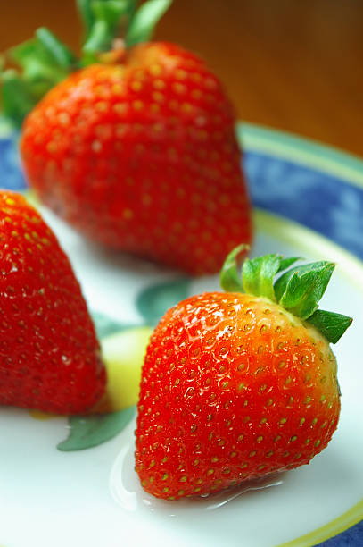 strawberries on plate stock photo