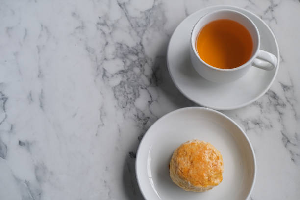 istock Tea with scones and clotted cream, jam, strawberries on the white table 1399019870
