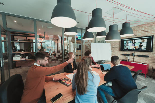 istock Successful team. Group of young multi-ethnic business people working and communicating together in creative office. Selective focus 1399020068
