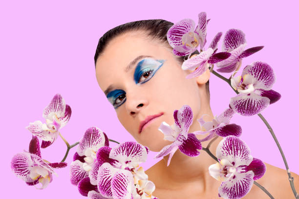 Photo shoot of young lady with make-up and skin care with orchid.