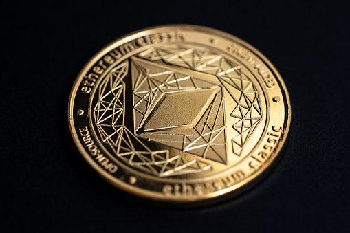 The two sides of an ancient gold coin isolated on white.