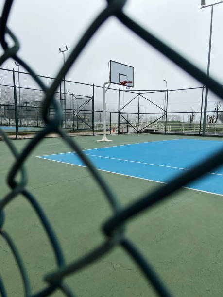 istock Outdoors fenced basketball court 1399020414