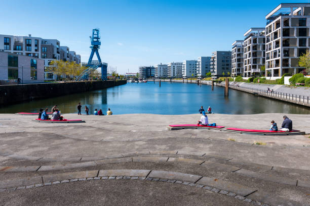 Offenbach, Germany - April, 19. 2022: View along River Main in Offenbach in Germany. On the sides are new buildings with apartments.