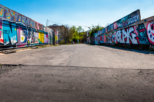 A Danish man walks alongside street graffiti in the artsy and free living commune of Freetown Christiania in Christianshavn, urban borough of Copenhagen.
