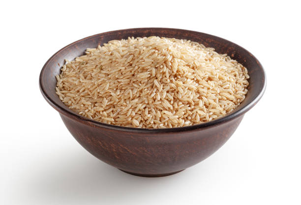 istock Brown rice in ceramic bowl isolated on white background with clipping path 1399021469