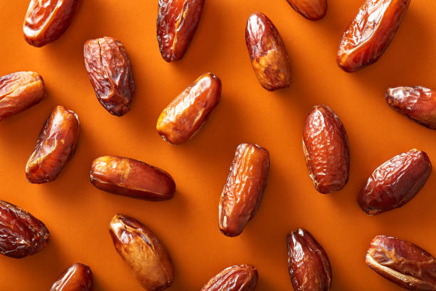 Dates pattern viewed from above on a white background. Top view stock photo