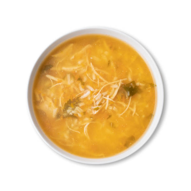 istock Chicken soup in a bowl isolated over white background 1399022832