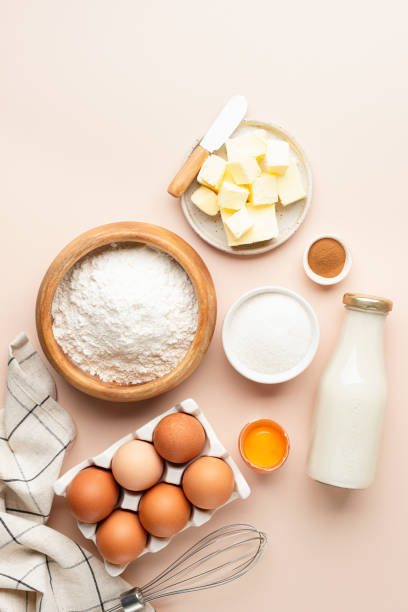 Baking ingredients for cakes bread cookies or pastry on beige background