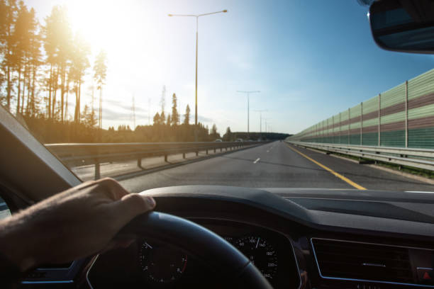 istock Male hand on the steering wheel. First person view. 1399024706