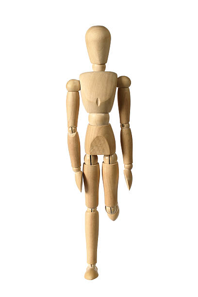 istock Wooden Figure Standing On One Leg 139902637
