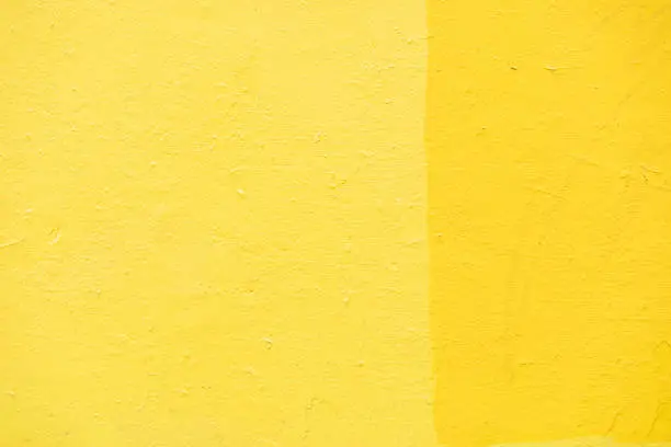 Photo of Yellow wall texture. Background yellow paint on wall. Bright color.