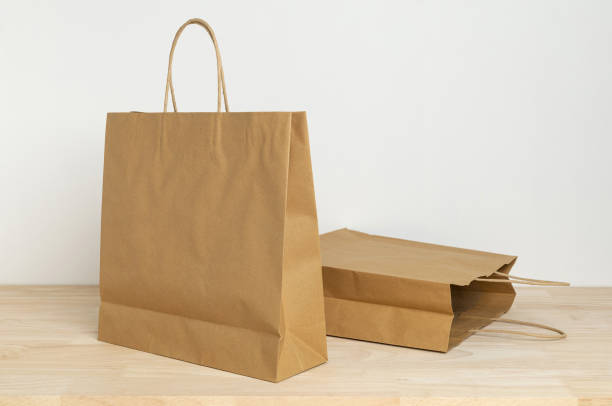 istock two brown paper bag on wooden table for mockup blank template 1399027791