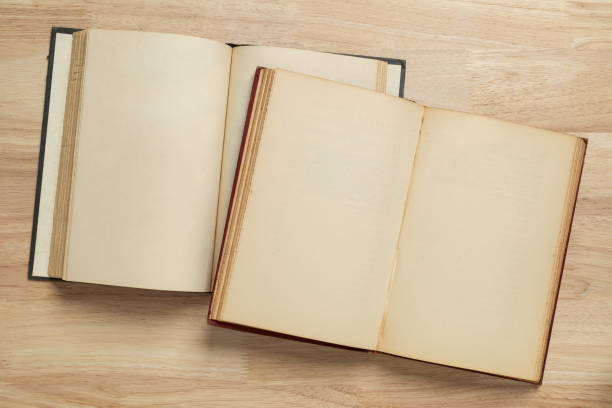 istock two open old book on wooden table for mockup blank template 1399027850