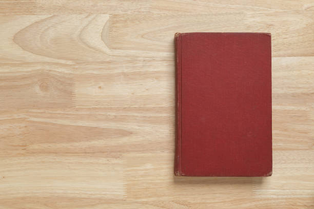 istock red hardcover book on wooden table for mockup blank template 1399027859