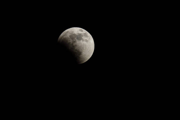 Moon and stars in the sky during the total moon eclipse Moon and stars in the sky during the total moon eclipse May 15, 2022 penumbral lunar eclipse stock pictures, royalty-free photos & images